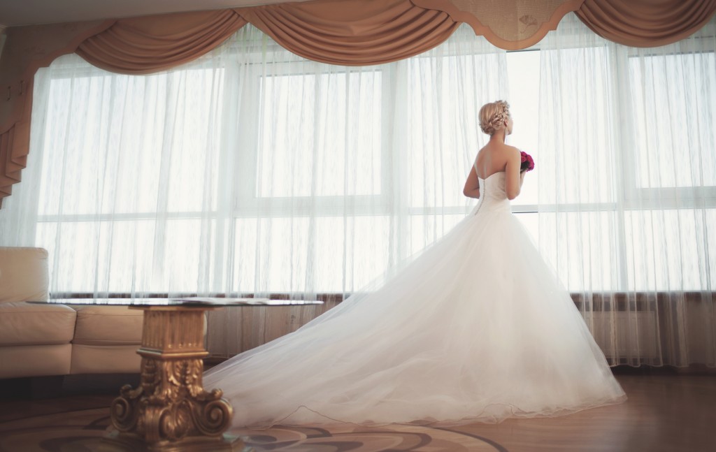 Beautiful bride in wedding dress with bouquet bridal flowers